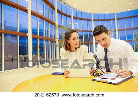 Executives with digital tablet, video conference View Large Photo Image Stock Photo - Executives with digital tablet, video conference. Fotosearch
