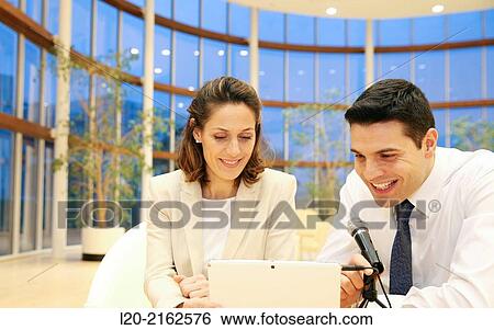Executives with digital tablet, video conference View Large Photo Image Stock Photograph - Executives with digital tablet, video conference. Fotosearch