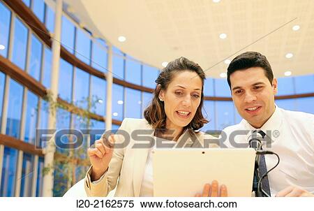 Executives with digital tablet, video conference View Large Photo Image Stock Photography - Executives with digital tablet, video conference. Fotosearch