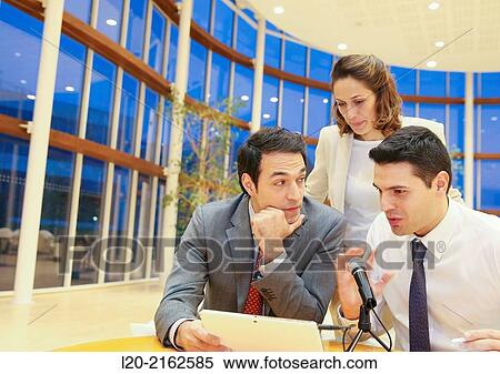 Executives with digital tablet, video conference View Large Photo Image Stock Photography - Executives with digital tablet, video conference. Fotosearch