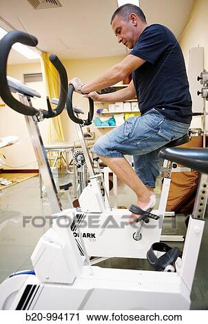 Exercise bike, increasing force production and flexibility, rebahilitation. Policlinica Gipuzkoa, San Sebastian, Donostia, Euskadi, Spain View Large Photo Image Stock Image - Exercise bike, increasing force production and flexibility, rebahilitation. Policlinica Gipuzkoa, San Sebastian, Donostia, Euskadi, Spain. Fotosearch