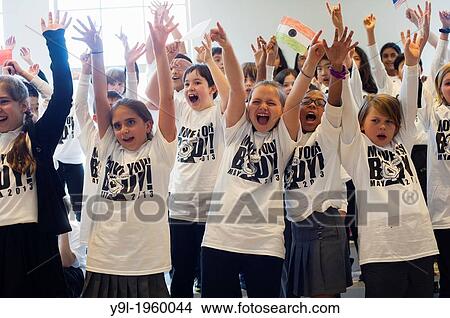 Picture - Exercisers participate in the Move Your Body campaign in Avenues The World School in Chelsea in New York. The campaign was launched by the WAT-AAH! Foundation in an effort to fight against childhood obesity.. Fotosearch