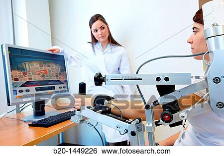 Stock Photograph - Exoskeleton and virtual environments for rehabilitation, Health and Biomedical applications, Vicomtech IK4, Centro de tecnologias de Interaccion Visual y Comunicaciones. Fotosearch