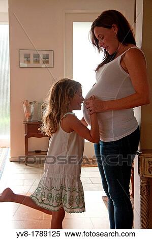 Expecting mother with her daughter View Large Photo Image Stock Photography - Expecting mother with her daughter. Fotosearch