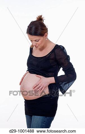 expecting woman - studio shot of a pregnant woman isolated on white View Large Photo Image Stock Photo - expecting woman - studio shot of a pregnant woman isolated on white. Fotosearch