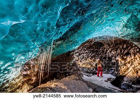 Stock Photography - Exploring an Ice Cave on Svinafellsjokull Glacier in Skaftafell National Park, Iceland.. Fotosearch