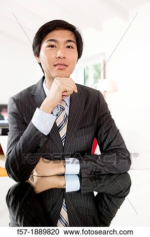 Expressive young Asian businessman View Large Photo Image Stock Image - Expressive young Asian businessman. Fotosearch