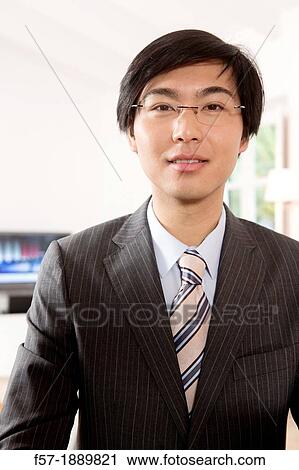 Expressive young Asian businessman View Large Photo Image Stock Image - Expressive young Asian businessman. Fotosearch