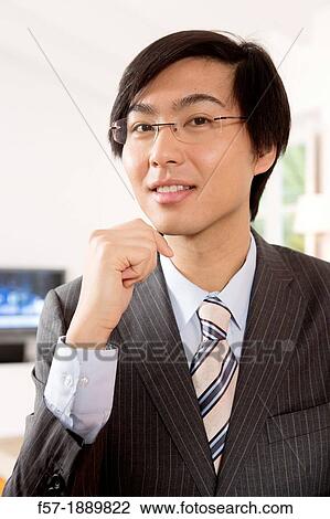 Expressive young Asian businessman View Large Photo Image Stock Image - Expressive young Asian businessman. Fotosearch