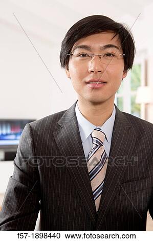 Expressive young Asian businessman View Large Photo Image Stock Image - Expressive young Asian businessman. Fotosearch