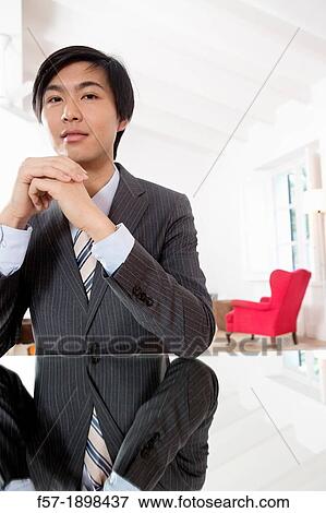 Expressive young Asian businessman View Large Photo Image Stock Photo - Expressive young Asian businessman. Fotosearch