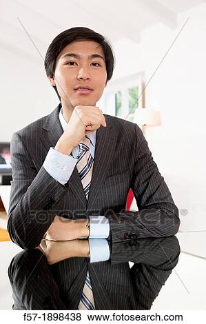 Expressive young Asian businessman View Large Photo Image Stock Photo - Expressive young Asian businessman. Fotosearch