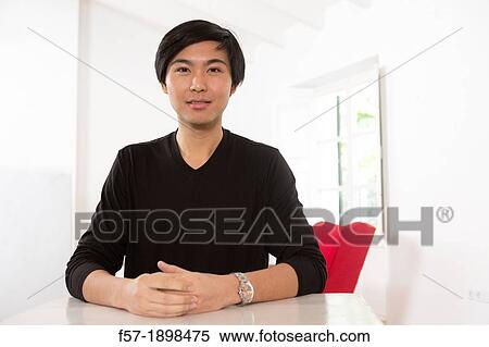 Stock Photography - Expressive young Asian man. Fotosearch