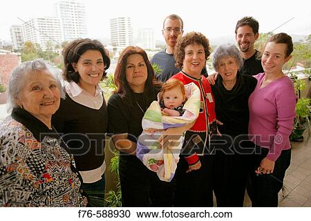 Extended family with two great grandmothers, two grandmothers, mother with her husband and brother and sister in law as well as housekeeper holding baby View Large Photo Image Stock Image - Extended family with two great grandmothers, two grandmothers, mother with her husband and brother and sister in law as well as housekeeper holding baby. Fotosearch
