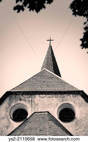 Exterior of old church almost looking like a face with two round windows for eyes, Sweden. View Large Photo Image Stock Photo - Exterior of old church almost looking like a face with two round windows for eyes, Sweden.. Fotosearch