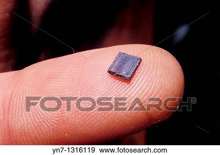 extreme close up of electronic chip on finger tip View Large Photo Image Stock Photo - extreme close up of electronic chip on finger tip. Fotosearch