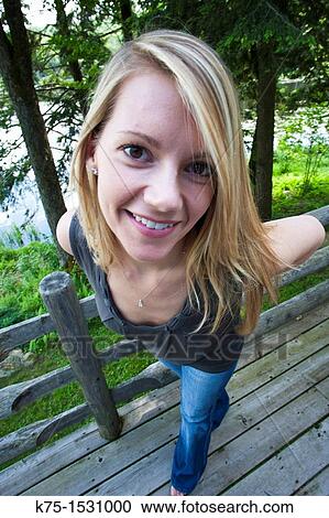 Extreme close-up of woman on deck View Large Photo Image Stock Image - Extreme close-up of woman on deck. Fotosearch