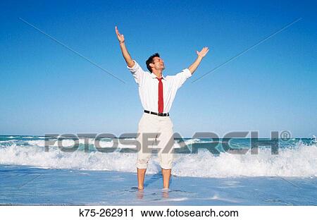 Exuberant man at the beach View Large Photo Image Stock Image - Exuberant man at the beach. Fotosearch