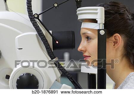 Eye examination Doctor using a retinal camera during an angiography examination of a patient's eye View Large Photo Image Stock Image - Eye examination Doctor using a retinal camera during an angiography examination of a patient's eye. Fotosearch