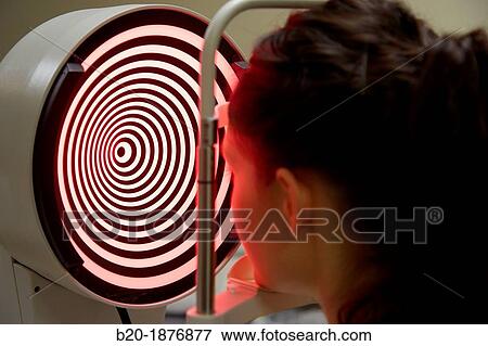 Eye examination Patient having a corneal topography measurement made of her eye View Large Photo Image Stock Photo - Eye examination Patient having a corneal topography measurement made of her eye. Fotosearch