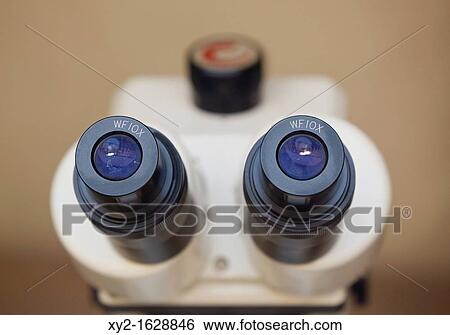 Stock Photograph - Eyepieces of microscope. Fotosearch