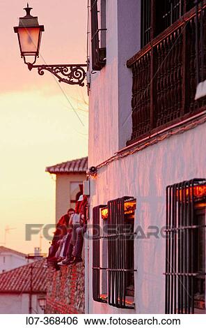 Fa? ade of house and tourists at sunset in the Albayzin. Grenada. Andalucia. Spain View Large Photo Image Stock Photograph - Fa? ade of house and tourists at sunset in the Albayzin. Grenada. Andalucia. Spain. Fotosearch