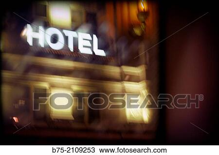 Facade of a hotel with bright tagline overnight. London, England, UK, Europe View Large Photo Image Stock Image - Facade of a hotel with bright tagline overnight. London, England, UK, Europe. Fotosearch