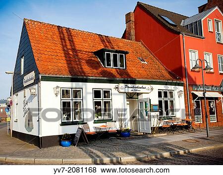 Facade of a restaurant in the center of Husum, North Friesian Islands, Schleswig-Holstein, Germany, Europe. View Large Photo Image Stock Photo - Facade of a restaurant in the center of Husum, North Friesian Islands, Schleswig-Holstein, Germany, Europe.. Fotosearch