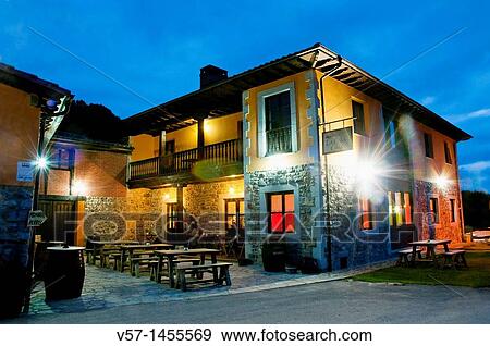 Stock Photo - Facade of La Pea? l Cura restaurant, night view. Porra, Asturias province, Spain.. Fotosearch