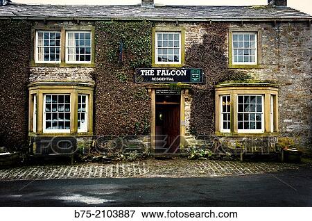 Facade of typical pub The Falcon in Arncliffe, Yorkshire Dales, England, UK. View Large Photo Image Stock Photo - Facade of typical pub The Falcon in Arncliffe, Yorkshire Dales, England, UK.. Fotosearch