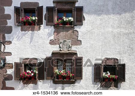 Facade with flowers and shield, Errazu, Erratzu Baztan, Navarre, Spain View Large Photo Image Stock Photograph - Facade with flowers and shield, Errazu, Erratzu Baztan, Navarre, Spain. Fotosearch