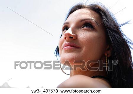 Face of a 25 year old pretty woman outdoors, close-up View Large Photo Image Stock Photo - Face of a 25 year old pretty woman outdoors, close-up. Fotosearch