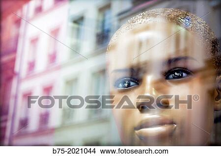 Face of a mannequin in a shop window with reflection of a building in Paris, France, Europe View Large Photo Image Picture - Face of a mannequin in a shop window with reflection of a building in Paris, France, Europe. Fotosearch