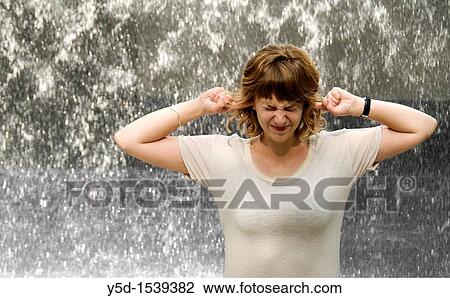 face of exhauted young woman in front of noisy falling water View Large Photo Image Stock Image - face of exhauted young woman in front of noisy falling water. Fotosearch