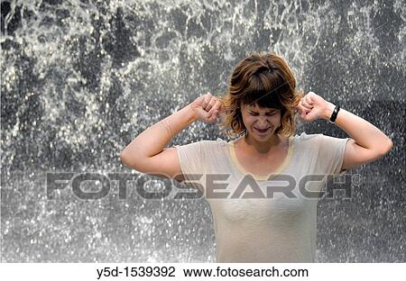 face of exhauted young woman in front of noisy falling water View Large Photo Image Stock Image - face of exhauted young woman in front of noisy falling water. Fotosearch