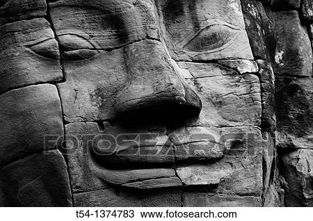 Stock Image - Face of the Lokeshwaram at Angkor Thom. Fotosearch