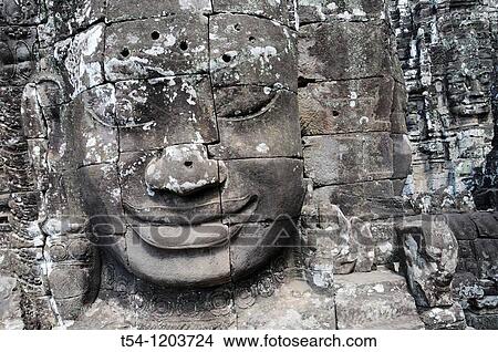Picture - Face of the Lokeshwaram in Bayon Temple in Angkor. Fotosearch