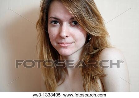 face of the pretty girl against light wall closeup blank expression View Large Photo Image Stock Photography - face of the pretty girl against light wall closeup blank expression. Fotosearch