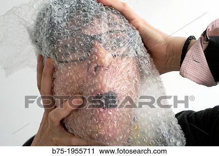 Face of woman with glasses with symptoms of panic with plastic on the face View Large Photo Image Stock Image - Face of woman with glasses with symptoms of panic with plastic on the face. Fotosearch