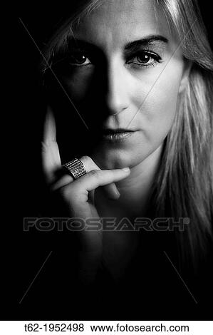 Face portrait of a beautiful young blonde staring at camera in black and white. View Large Photo Image Stock Photo - Face portrait of a beautiful young blonde staring at camera in black and white.. Fotosearch
