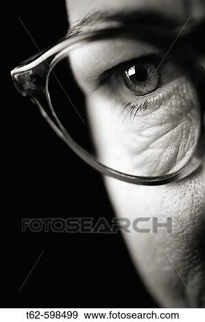 Face with wrinkles. Detail of eye with glasses. View Large Photo Image Stock Photo - Face with wrinkles. Detail of eye with glasses.. Fotosearch