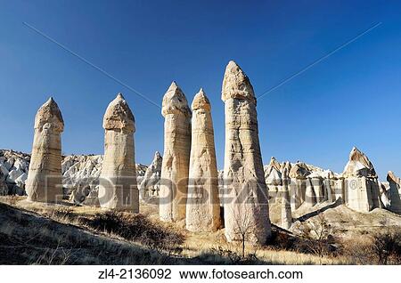 Stock Image - Fairy chimneys in the white Valley, also known as the Love Valley. Turkey, Central Anatolia, Nevsehir Province, Cappadocia, Goreme national park.. Fotosearch