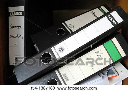 Stock Image - Fallen binders on a shelf. Fotosearch