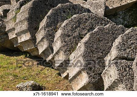 Fallen column drums at the Temple of Zeus at ancient Olympia, Peloponnese, Greece View Large Photo Image Stock Image - Fallen column drums at the Temple of Zeus at ancient Olympia, Peloponnese, Greece. Fotosearch