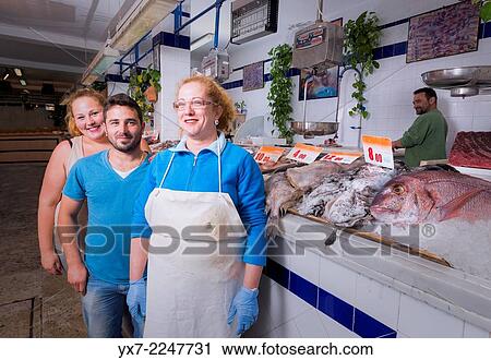 Familiy working in a fish market. Tarifa market, Cadiz, Andalusia, Spain. View Large Photo Image Stock Image - Familiy working in a fish market. Tarifa market, Cadiz, Andalusia, Spain.. Fotosearch