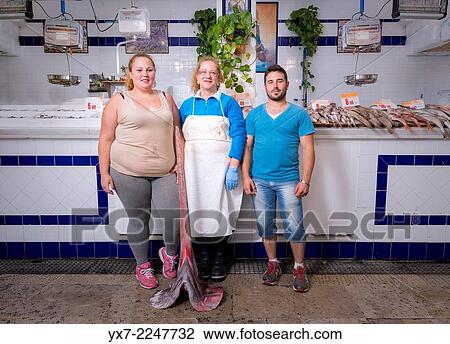 Familiy working in a fish market. Tarifa market, Cadiz, Andalusia, Spain. View Large Photo Image Stock Image - Familiy working in a fish market. Tarifa market, Cadiz, Andalusia, Spain.. Fotosearch