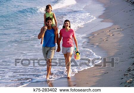 Stock Image - family at beach. Fotosearch