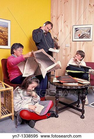 Family at home all engaged in some form of reading View Large Photo Image Stock Photography - Family at home all engaged in some form of reading. Fotosearch
