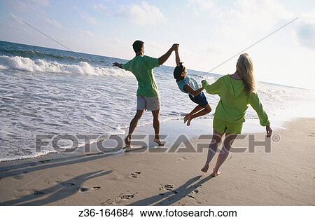 Family at the beach View Large Photo Image Picture - Family at the beach. Fotosearch