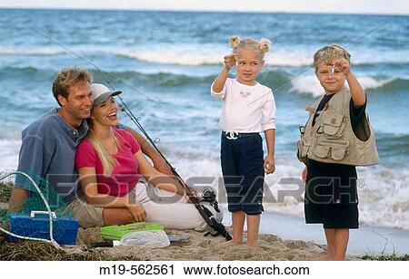 Stock Image - family at the beach. Fotosearch